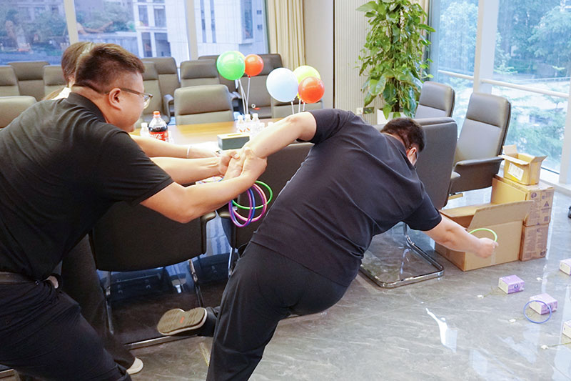 As summer unfolds and daylight stretches, the COANTEC family gathered for a heartwarming "Dragon Boat Festival Celebration" – a combined monthly staff birthday party and engaging team‑building activity that infused festive spirit with a genuine sense of belonging. Celebrating Birthdays with Warmth and Appreciation The event kicked off with colleagues exchanging Dragon Boat Festival greetings, followed by dedicated birthday wishes for our celebrants. Soft music filled the room as everyone sang "Happy Birthday," with candlelight glowing on each joyful face. Our second‑quarter birthday staff made their wishes, shared snacks, and posed for group photos amid rounds of applause and cheers. At COANTEC, we truly value every individual – celebrating every birthday and recognizing every contribution as part of our people‑first culture. Interactive Games That Sparked Laughter and Connection After a brief warm‑up, two inclusive and easy‑to‑join games brought energy and excitement to the entire team: Dragon Boat Festival Quiz – Fifty engaging questions drawn from our employee handbook challenged participants in a fast‑paced Q&A session. Team members lined up to draw questions and had just 30 seconds to answer. Correct answers earned lovely zongzi‑shaped souvenirs, while wrong answers triggered lively re‑challenges. The room buzzed with laughter and cheers as colleagues revisited COANTEC's brand culture and flagship products – with many seasoned staff confidently answering multiple questions correctly. Dry‑Land Zongzi Hoop Throw – Each participant received three hoops to toss at target props on the floor within a set time and distance. With two rounds available, almost everyone walked away with prizes. Between games, colleagues enjoyed snacks and shared stories from work and daily life, creating a truly warm and relaxed atmosphere. COANTEC is committed to fostering a simple, transparent, and harmonious workplace – and these team‑building moments perfectly reflect our collective spirit. A Memorable Conclusion with Lasting Impressions The event drew to a successful close amid rounds of applause and cheerful conversations. Photos captured every smile, preserving the warmth and camaraderie of the COANTEC family. Looking ahead, COANTEC will continue to empower our teams through diverse activities, ensuring every employee feels the care and support of our company on their professional journey.